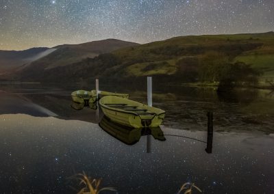 Some remarkable Nightscape reflections of the stars with some fishing boats at Llyn Nantlle, as the world stood still. | Elgan Jones Photography